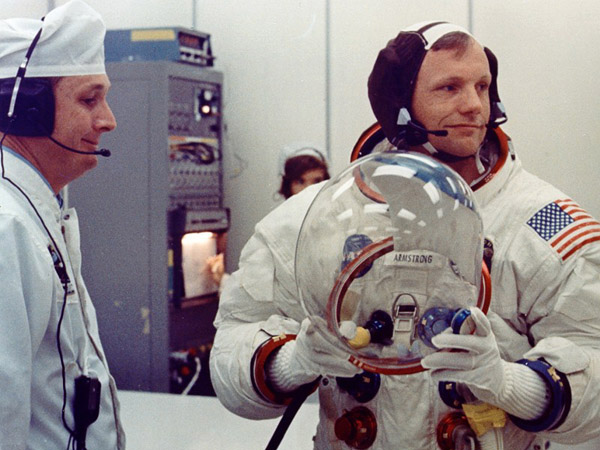 Apollo 11 Neil Armstrong gets fitted into his pressure suit