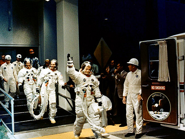 The Apollo 11 crew head for the van
